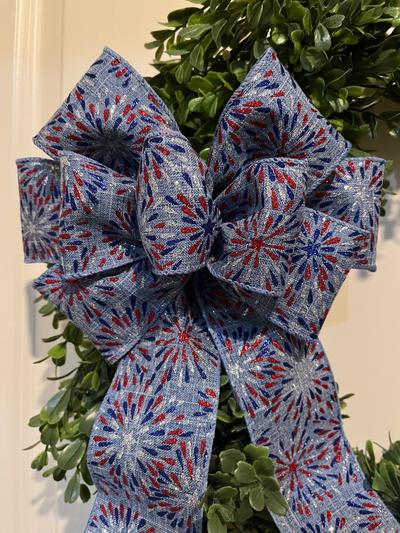 Patriotic decorative wreath bow in blue with fireworks design