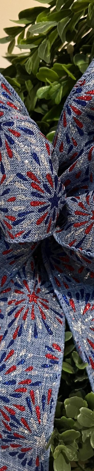 Patriotic decorative wreath bow in blue with fireworks design