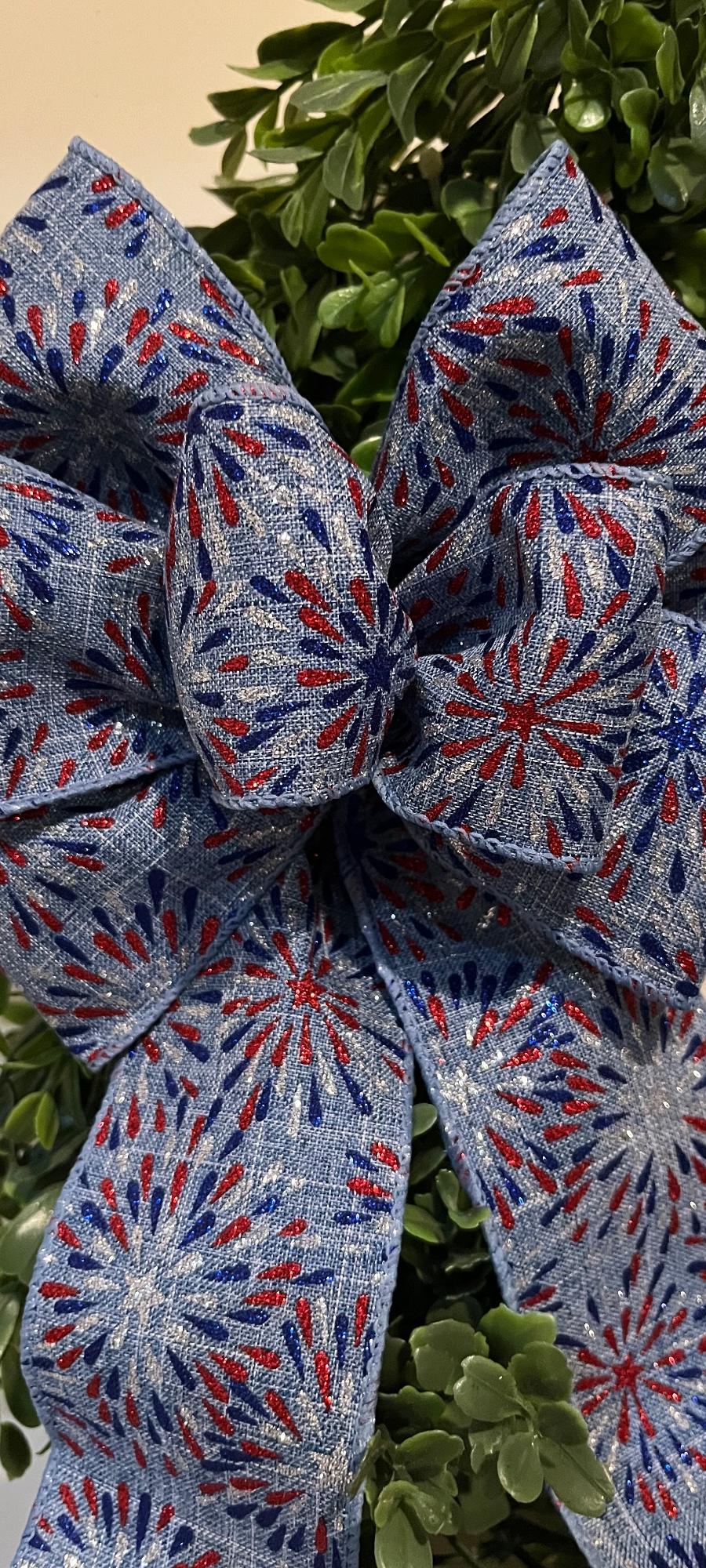 Patriotic decorative wreath bow in blue with fireworks design