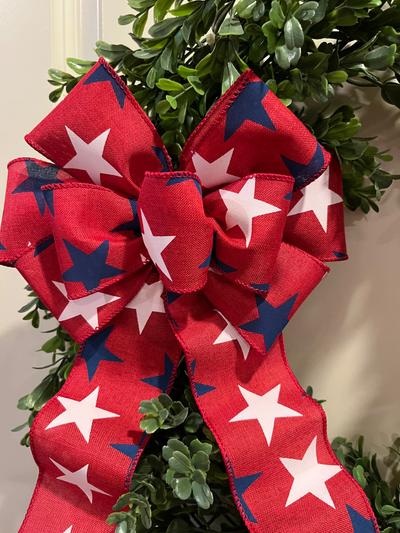 Patriotic bow. Blue and white stars on Red ground.  