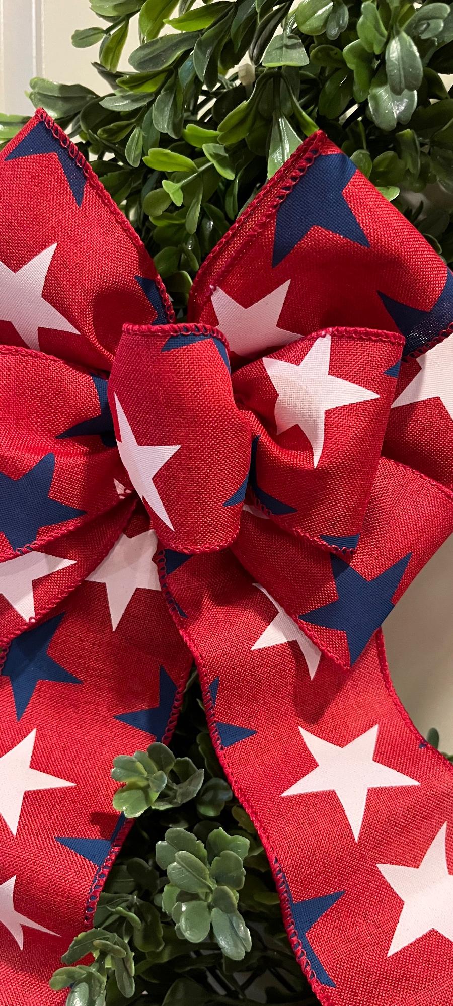 Patriotic bow. Blue and white stars on Red ground.  