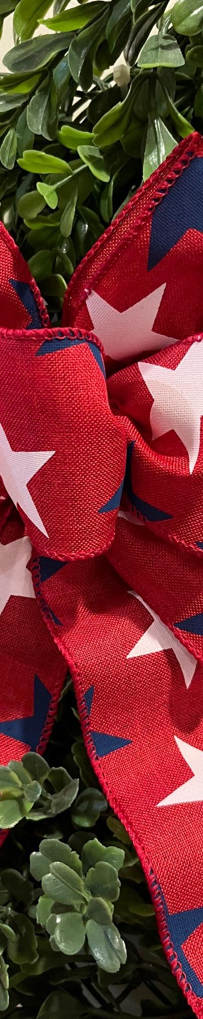 Patriotic bow. Blue and white stars on Red ground.