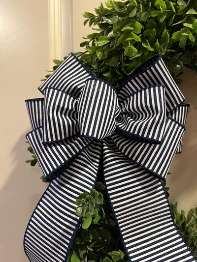 Navy blue and white striped decorative bow