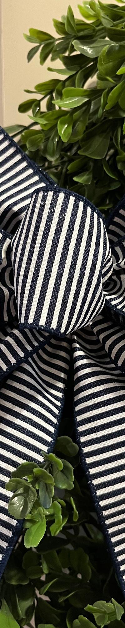 Navy blue and white striped decorative bow