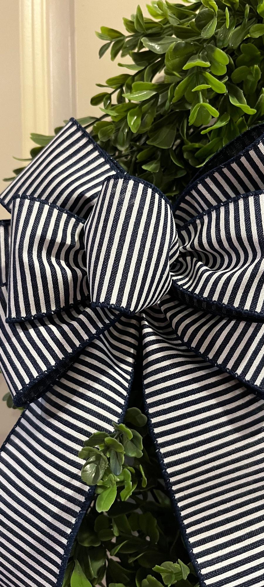 Navy blue and white striped decorative bow