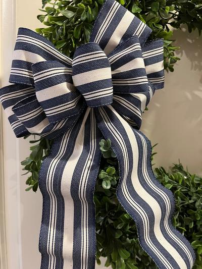 Navy blue Chambray stripe and off white hand tied decorative bow.