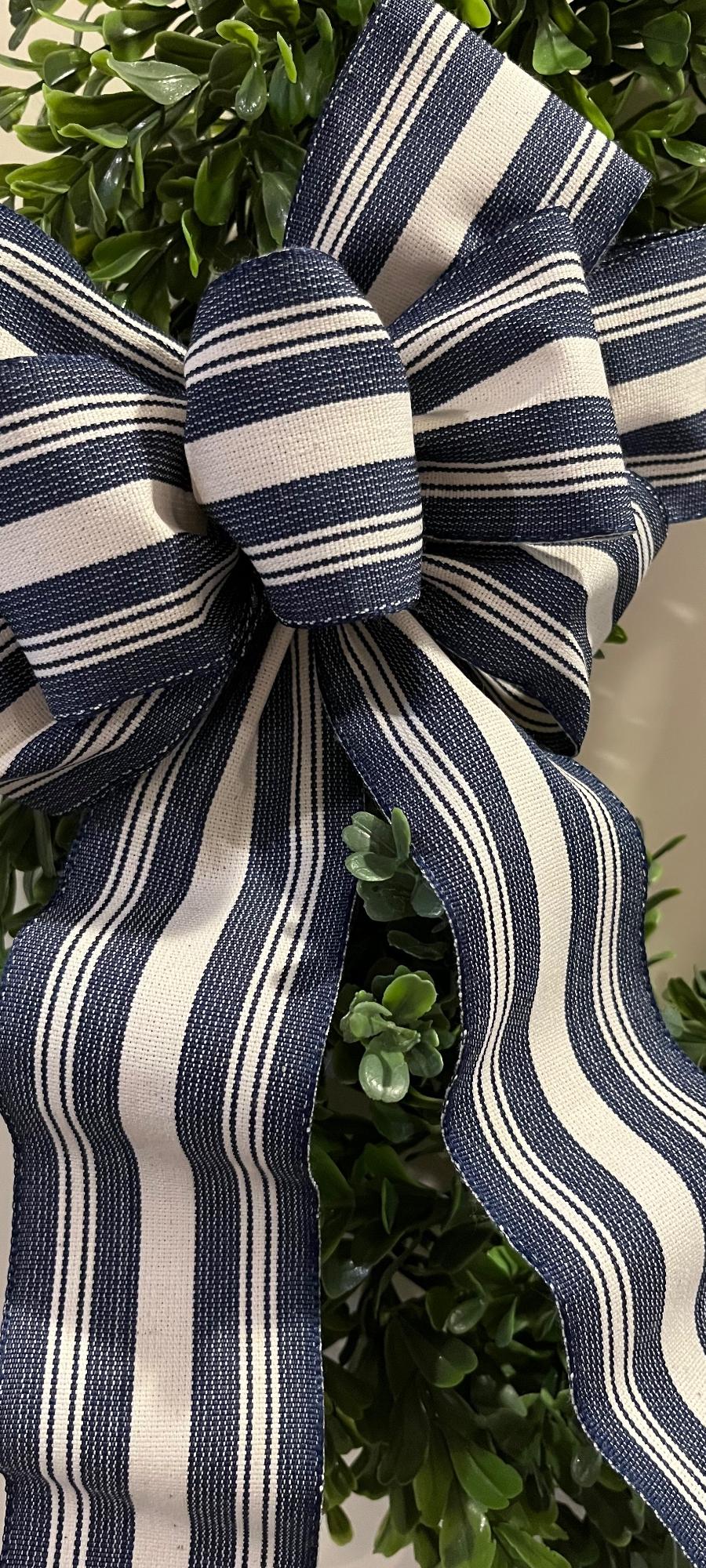 Navy blue Chambray stripe and off white hand tied decorative bow.